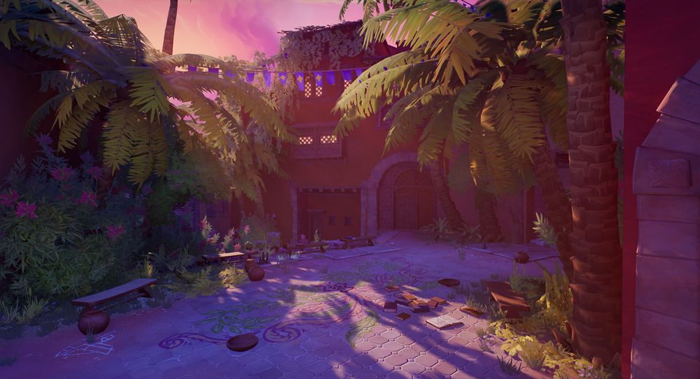 A screenshot from the game "En Garde!". A small plaza surrounded by a few houses and a lot of plants, in the late afternoon. There are floral drawings on the paved ground. 