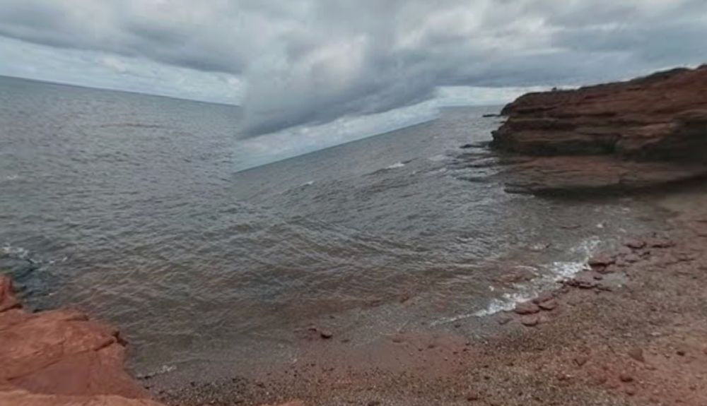 a still from Google Maps street view of Cavendish cliffs but a piece of the sea/horizon is at a drastic angle 