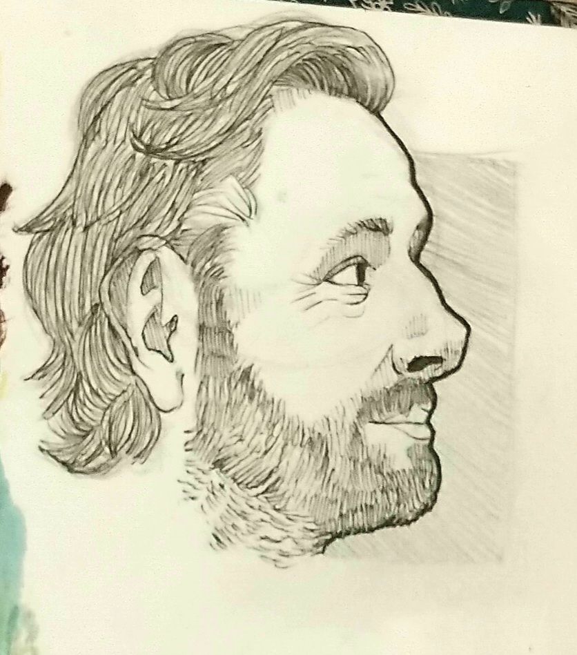 A bloody good side profile portrait of Michael Sheen
