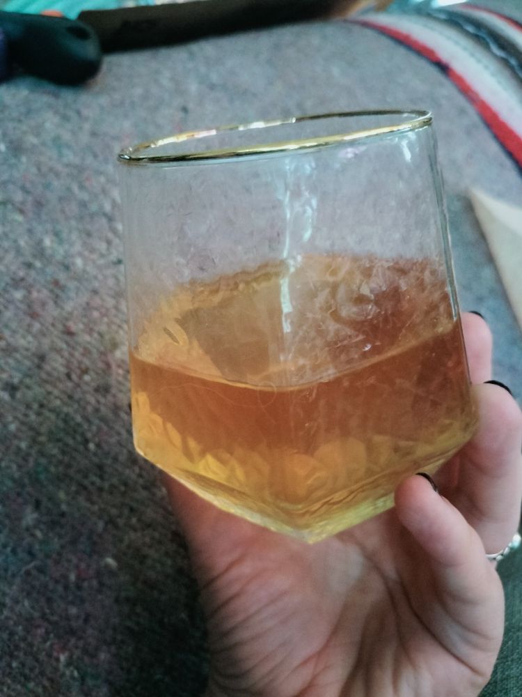 Amber colored mead in a hexagonal glass