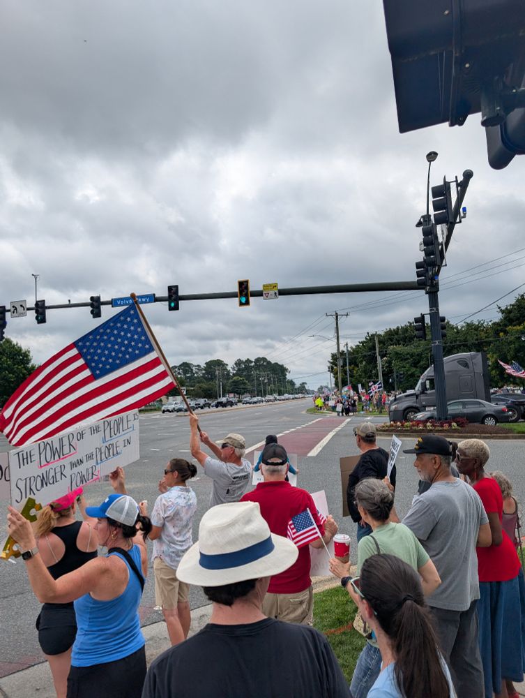 People protesting on the side of a road