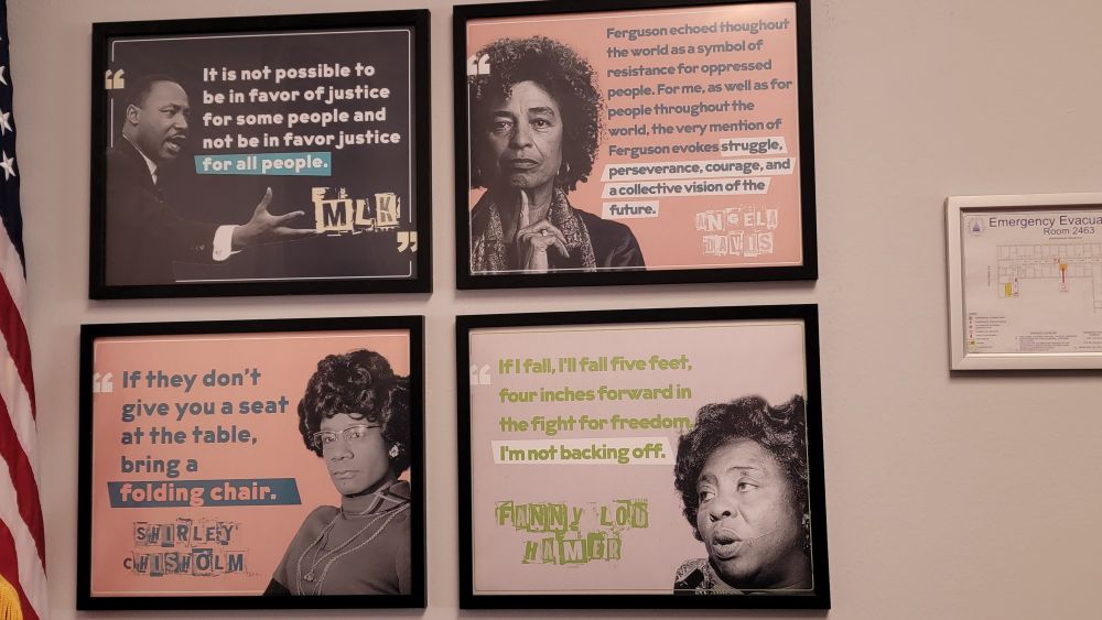 Pictures and quotes from Dr. Martin Luther King, Jr., Dr. Angela Davis, Rep. Shirley Chisholm, and Fanny Lou Hamer on the walls of Rep. Cori Bush's Congressional office. 