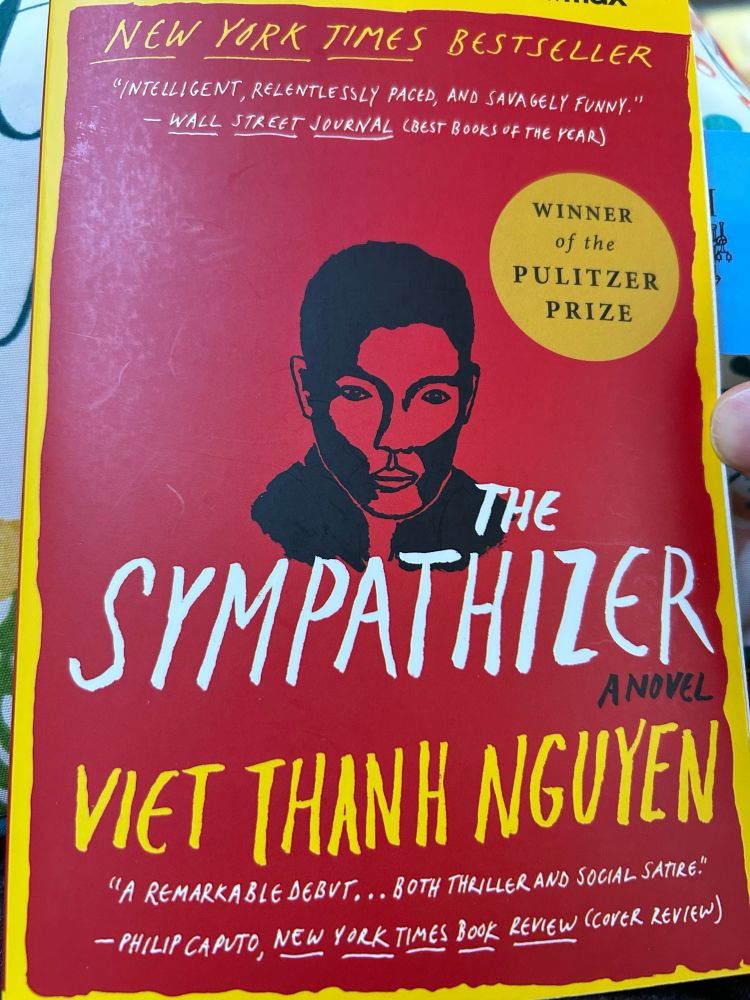 Cover of book with drawing of main character. Title “The Sympathizer”