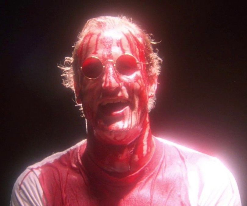 Woody Harrelson as Mallory in Natural Born Killers, literally covered in blood.