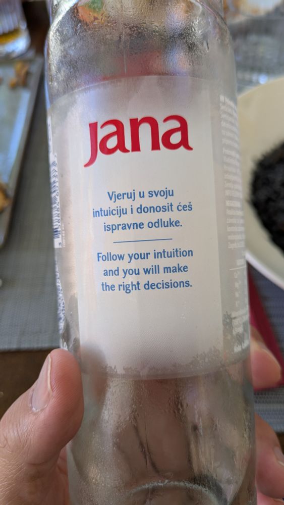 A bottle of water emblazoned with "follow your intuition and you will make the right decisions"