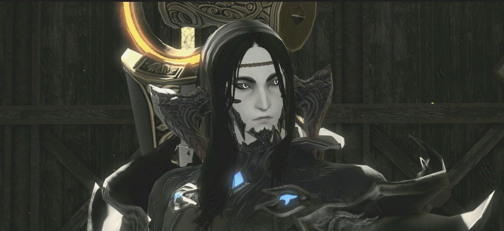 White man with black hair, black horns, and black face scales. He is looking to the right with a neutral expression. He is wearing a black top with paldrons, with a scythe on his back.