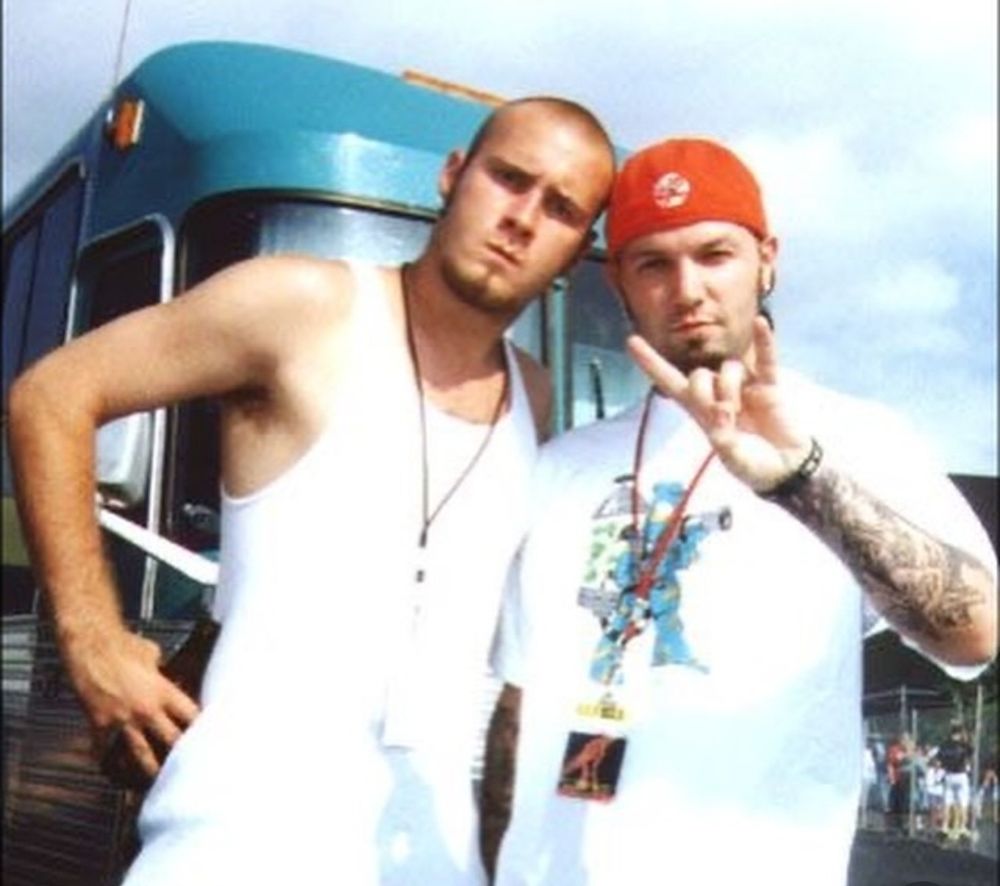 Old Ozzfest photo of Sam Rivers & Fred Durst standing in front of their tour bus
