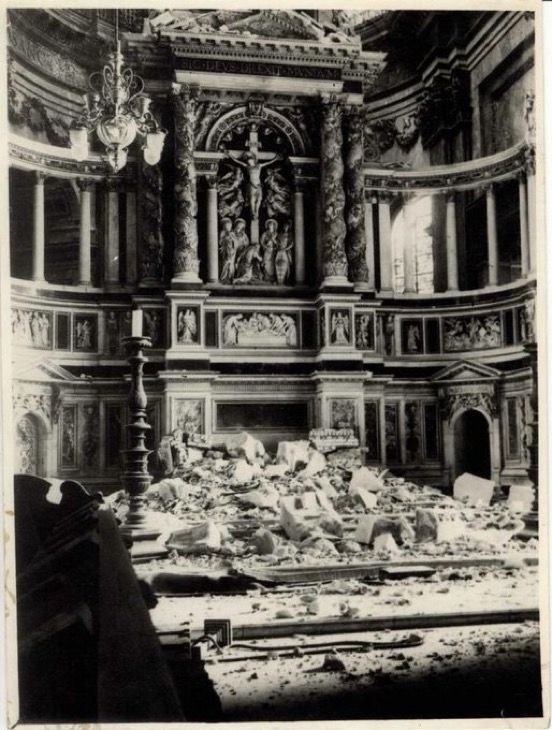 High Altar of St Paul’s Cathedral, damaged by falling masonry after a bomb struck the roof of the East End  at 6am on 10th October. The photograph shows an ornate religious backdrop, with an image of Jesus on the cross in the centre. The altar itself has been crushed underneath a pile of rubble.
📷 stpauls.co.uk