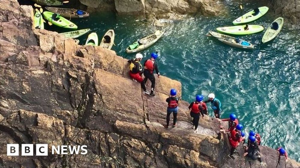 Dorset: Man died while coasteering with sons, inquest hears