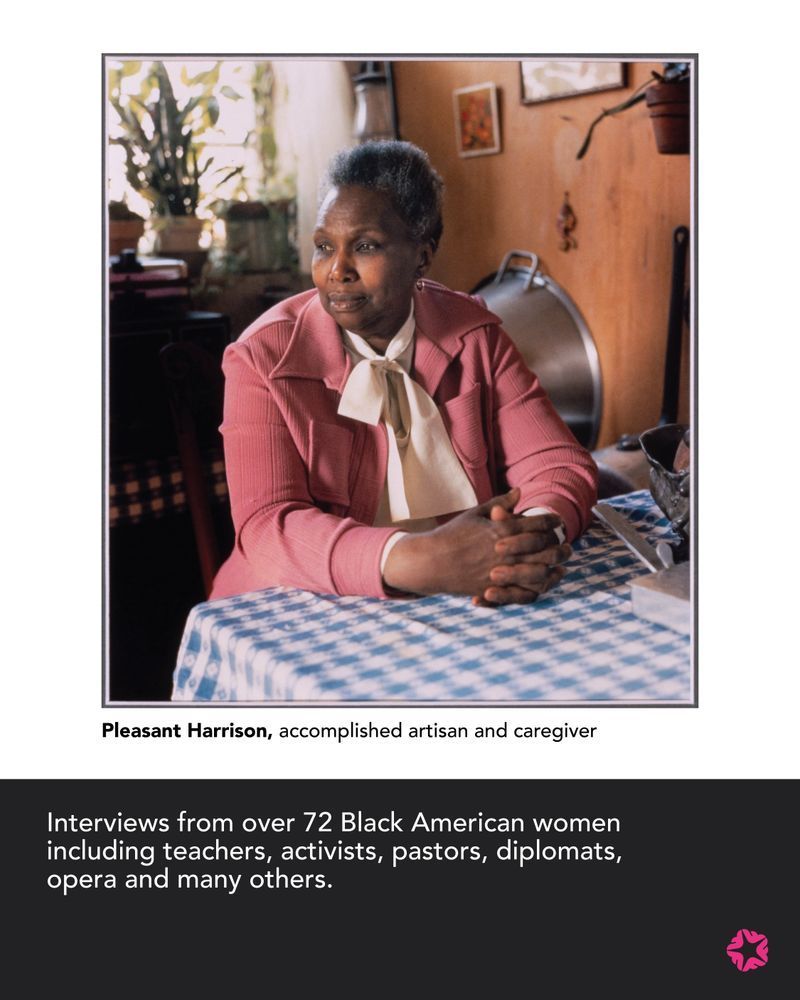 Pleasant Harrison, accomplished artisan and caregiver, sitting in a home environment, looking into the distance with hands folded on a blue and white patterned table.
