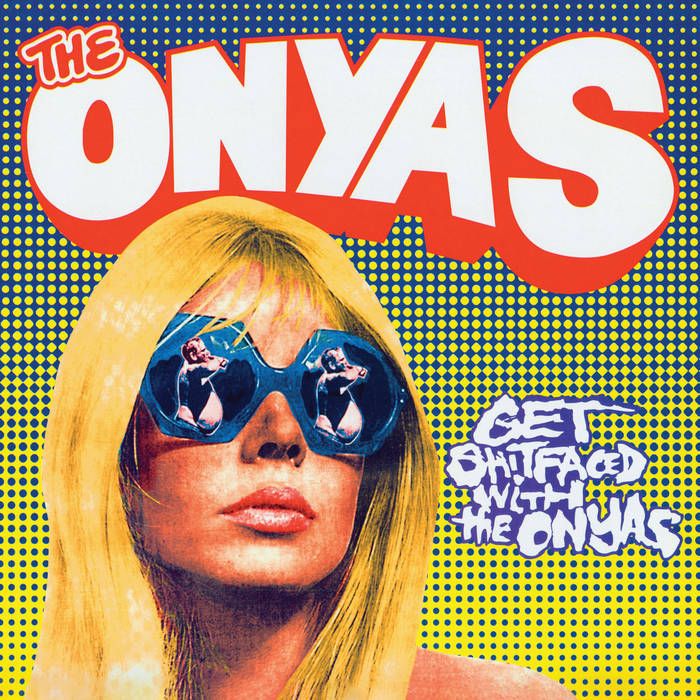 Album cover for The Onyas' "Get Shitfaced with The Onyas." Features a pop art-style blonde woman wearing large blue sunglasses reflecting images of a woman in a black outfit. The background is yellow with blue dots, and the album title is written in bold, graffiti-style text.