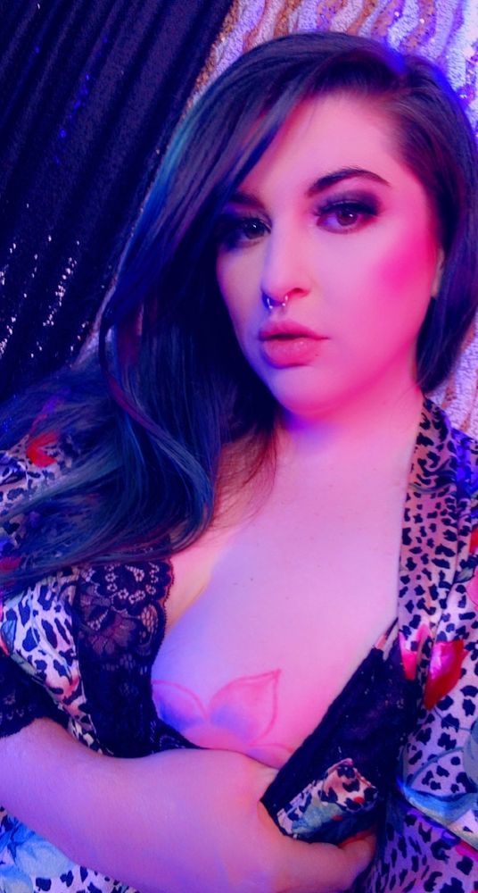 Goddess Joules in a leopard print satin robe.