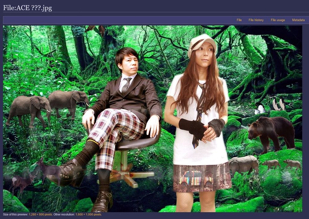 Detail of said promotional image; the background is an obviously-photoshopped jungle with an assortment of various animals. The two composers are wearing silly clothing.