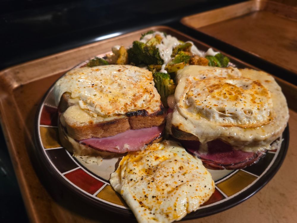 A plate of croque madames with an extra hat (fried egg) HONHONHON
