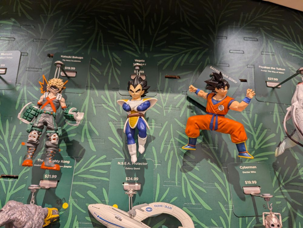 Display of Hallmark Christmas ornaments specifically focused on Vegeta and Goku from Dragon Ball Z