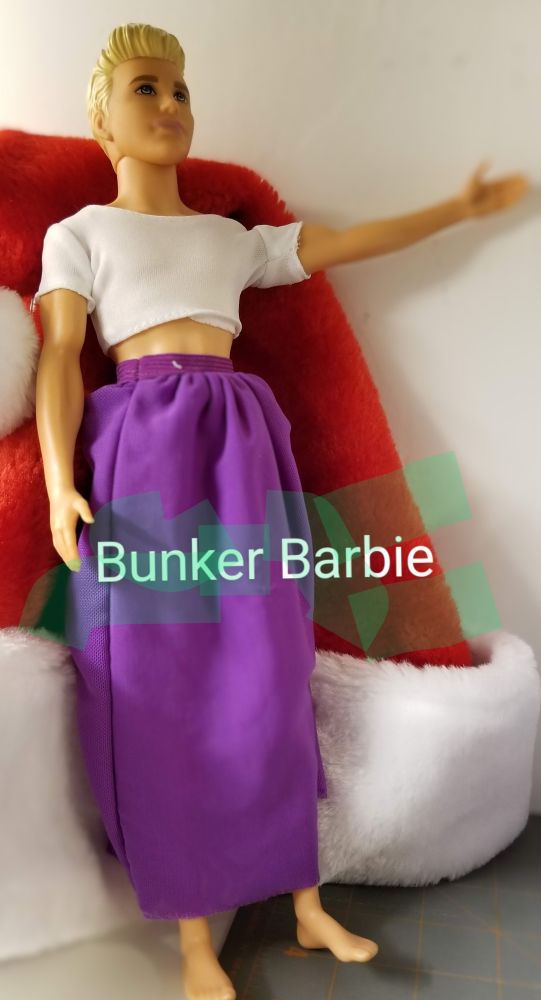 Barbie Doll, most likely Ken, gesturing the path to the safety of the Underground Dream House 