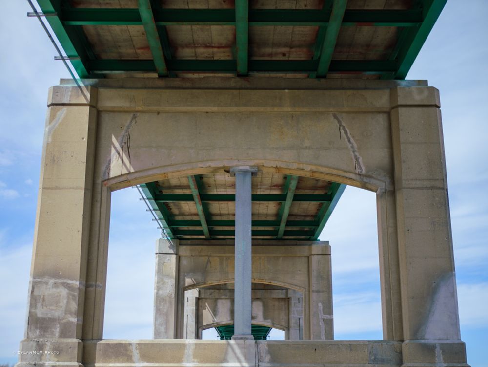 A cool picture of the underside of a bridge. 