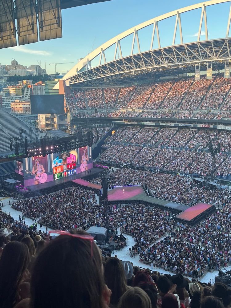 Stadium packed with swifties and the eras tour stage from a front facing nosebleed during the Lover welcome speech 