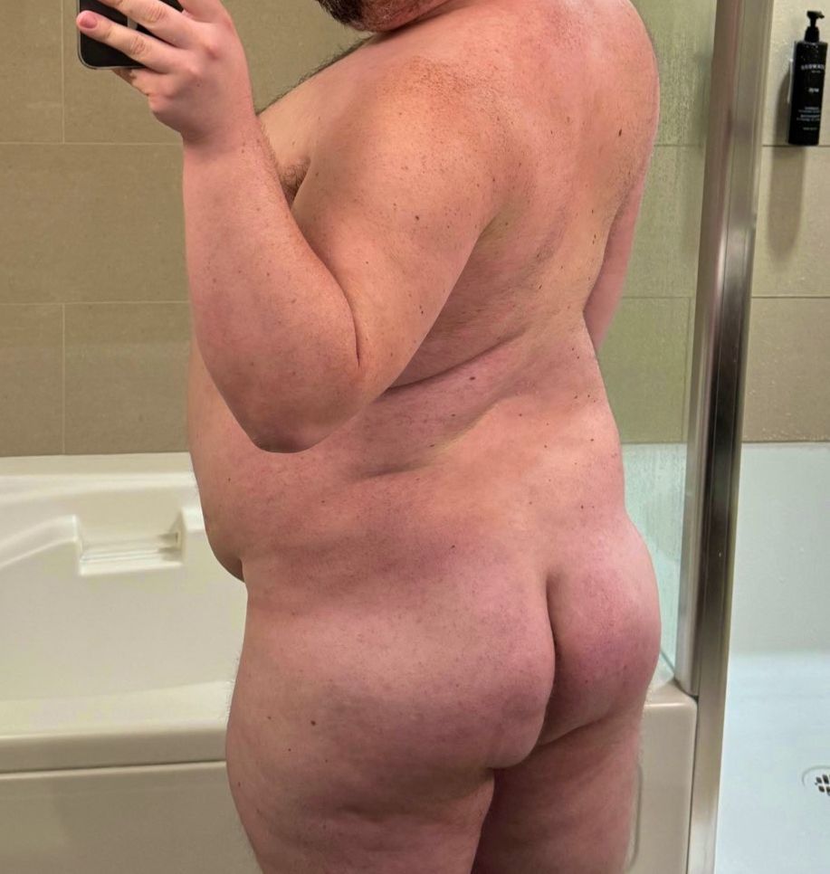 Beefy bear is naked and shows off his bare butt and back.