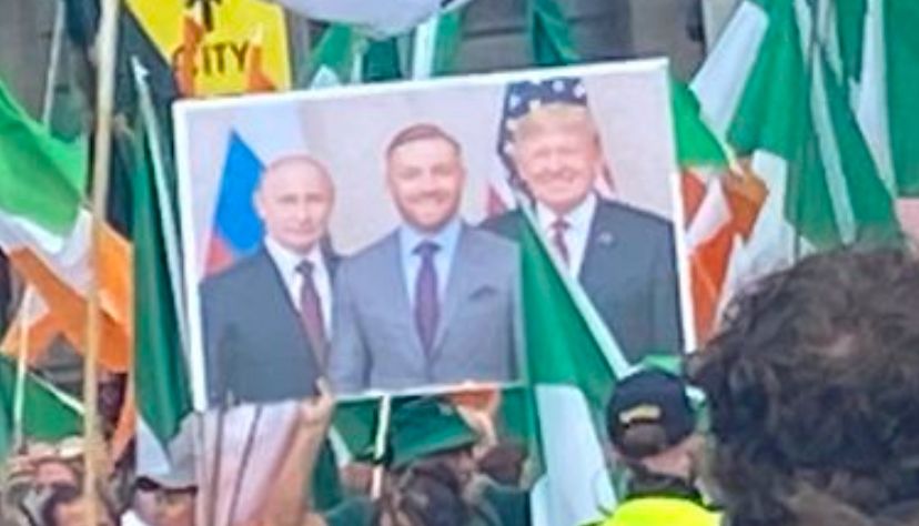 A close up of the poster of Vladimir Putin, Conor McGregor and Donald Trump. 