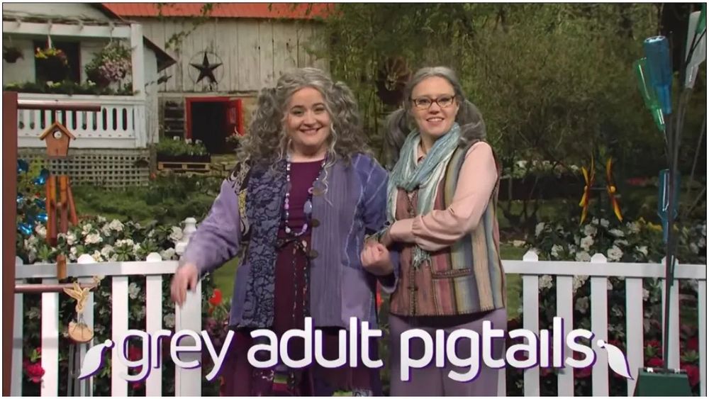 Still from Saturday Night Live “grey adult pigtails” sketch with Aidy and Kate