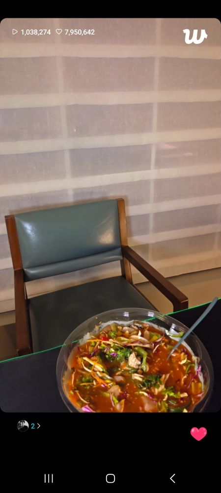 A live but all we see is an empty chair and plate with a lot if food in it