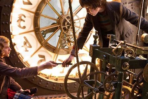 Hugo and friend in behind clock face