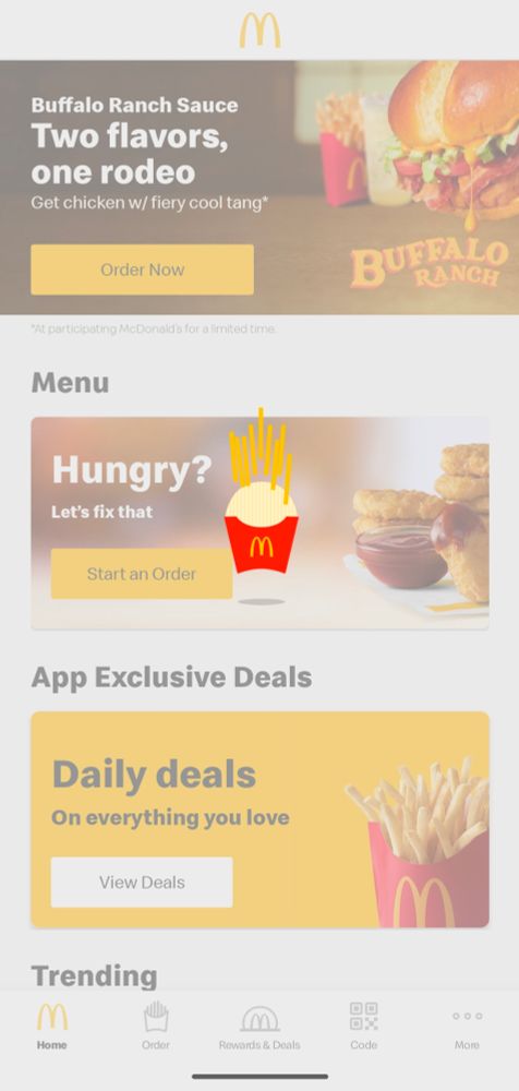 Grayed out McDonald's app with a cartoon fries container bouncing up and down in the foreground 