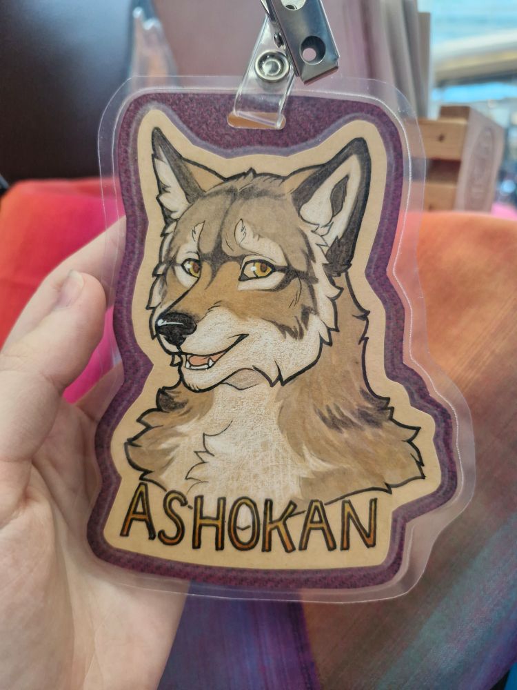 A badge of canid Ashokan, featuring some striking but stylized natural markings.