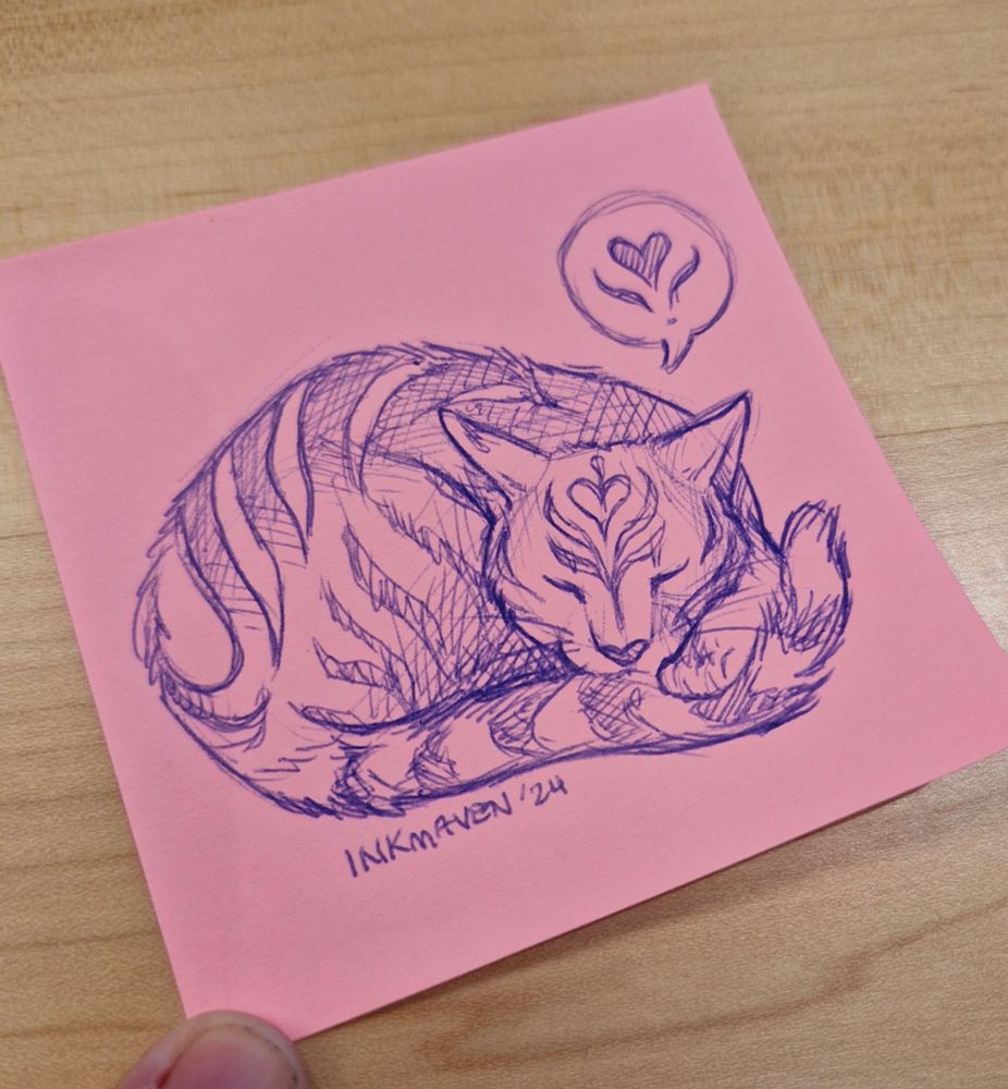 A photo of a pink post-it note. In blue pen, a curled up tabby cat is sketched, with latte-art inspired stripes.