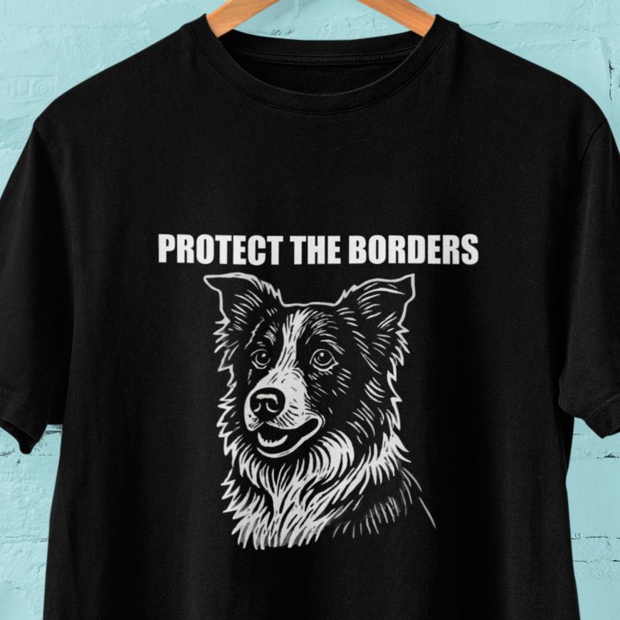 Black t-shirt on a hanger with bold white text that reads “PROTECT THE BORDERS” above a stylized illustration of a Border Collie’s face.