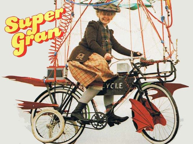A promotional image of 80s Scottish kids TV character “Super Gran”, riding her trademark flying bicycle.