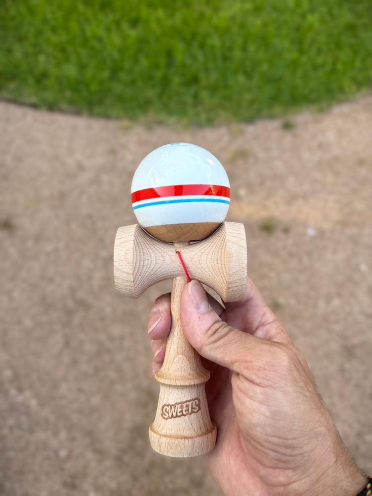 A Sweets Kendama held in hand