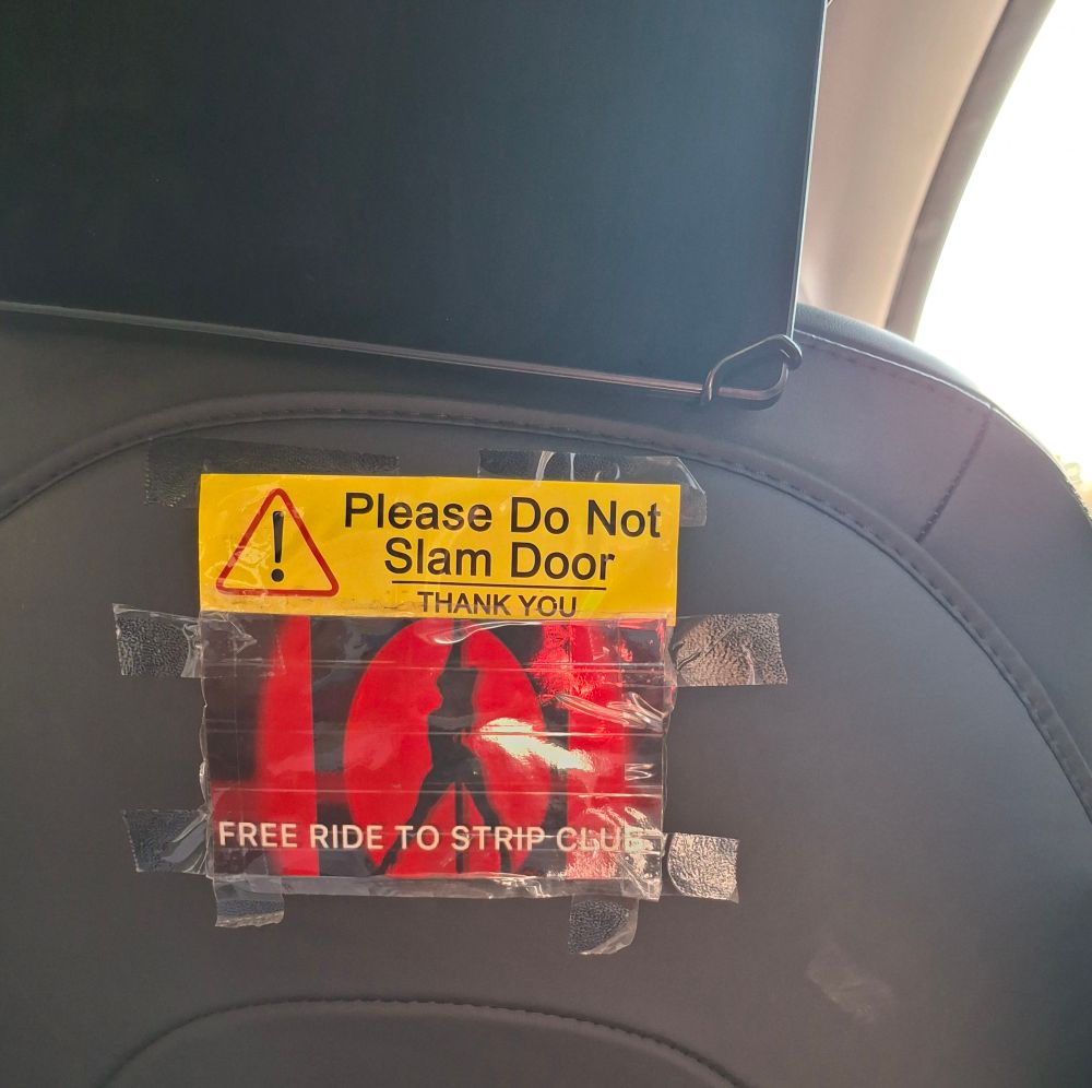Tapped to the back seats of an Uber we took