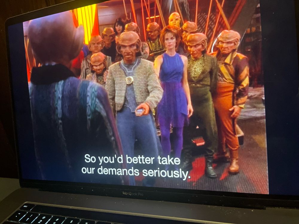 the quark's bar union!!!!! rom and leeta and a bunch of ferengis. caption: "So you'd better take our demands seriously."