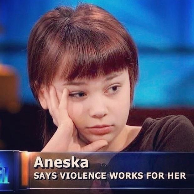 Meme of a still from a Dr. Phil interview. An unamused girl is pictured with a banner reading “aneska says violence works for her” 