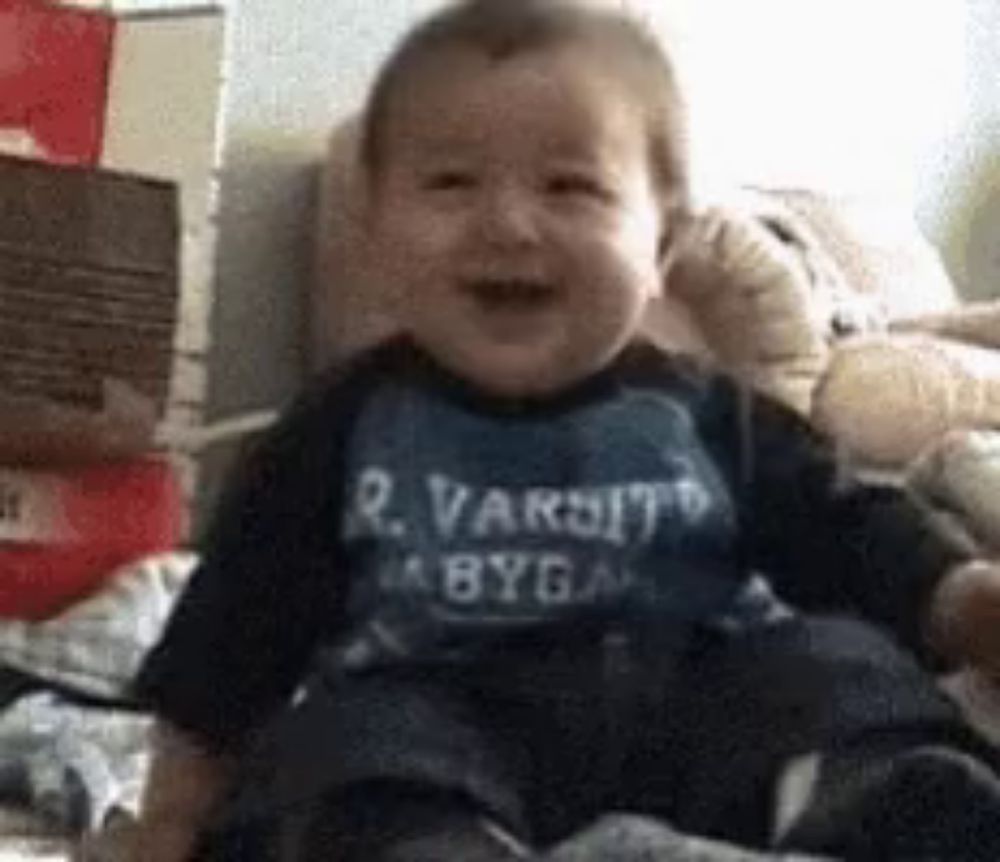 a baby wearing a shirt that says r. varsity a byga