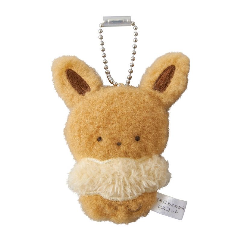 photo of a little fluffy plush eevee keychain.