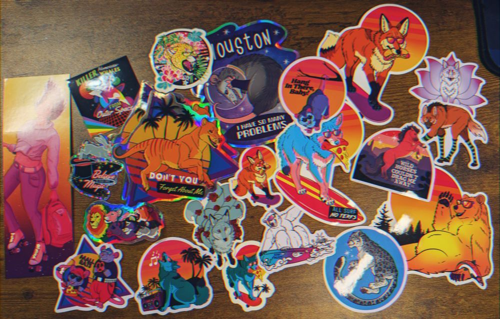 A wide array of animal themed stickers, most have a neon retro aesthetic.