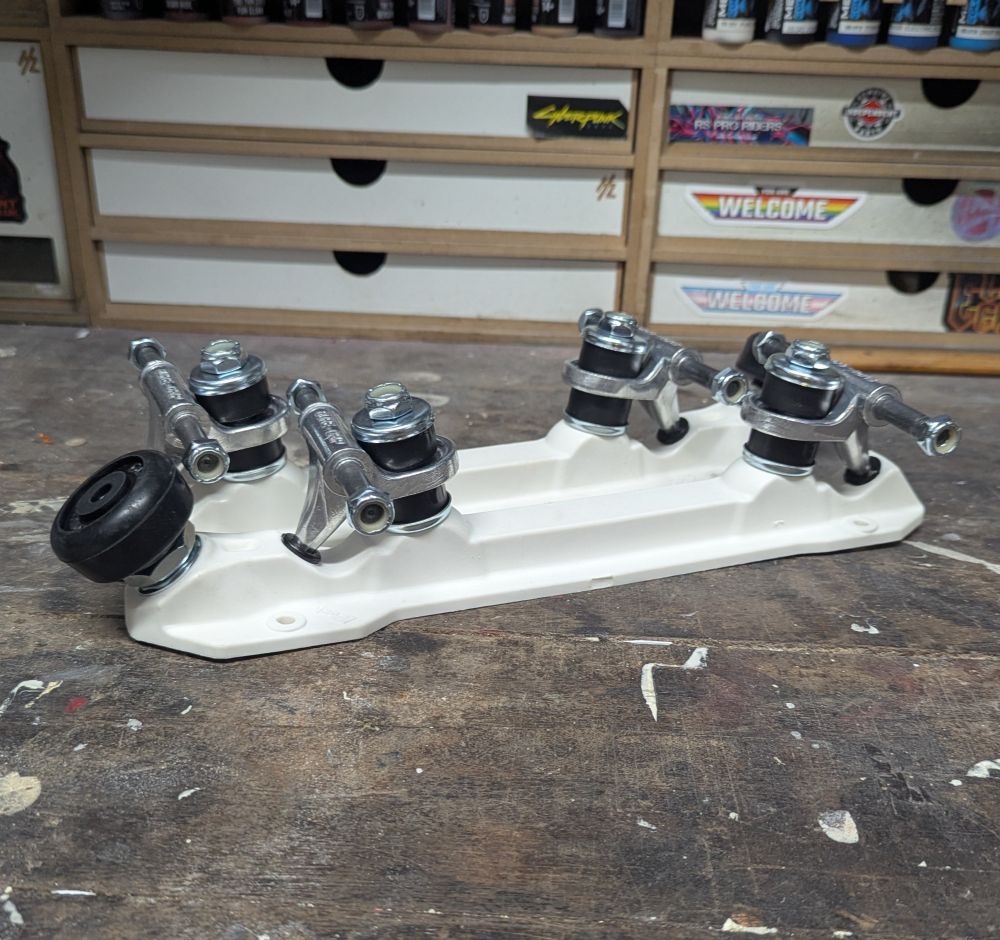 A pair of nylon Sure Grip Rock plates in white.