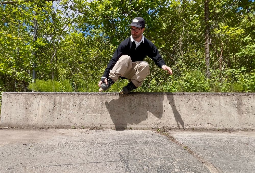 backside backslide grind on a street ledge.