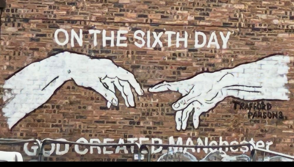 graffiti - hand of god and man from sistine chapel and ‘On the 6th day God created MANchester