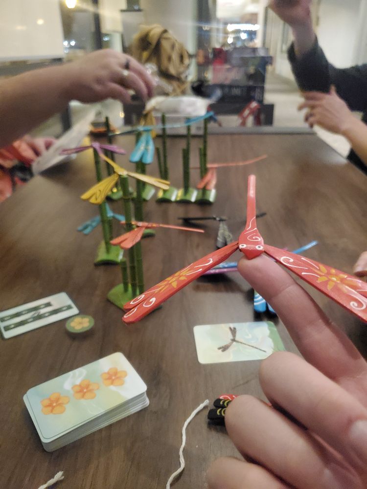 The board game Chuồn Chuồn, where wooden dargonflies are placed on bamboo stalks.