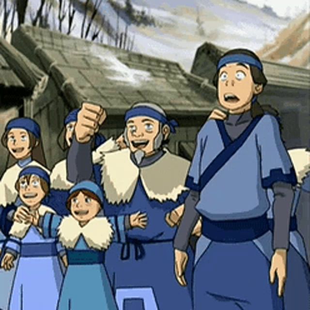 a group of people in blue clothes are standing together