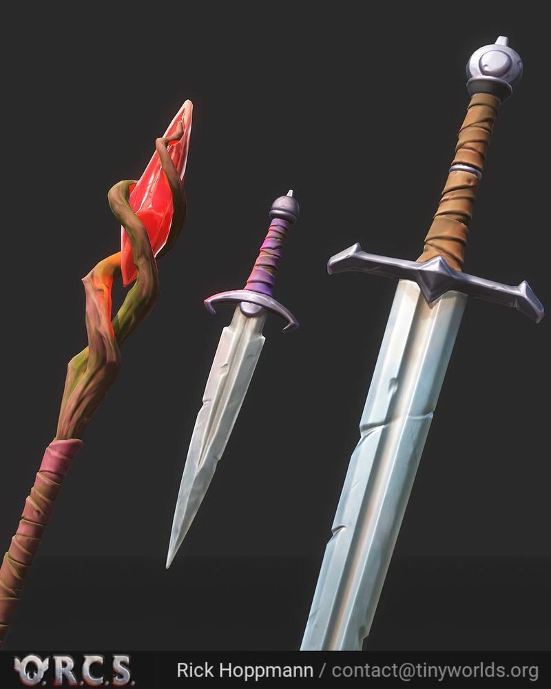 Screenshot of a stylized 3D wizard staff with a red gem, a dagger and a longsword