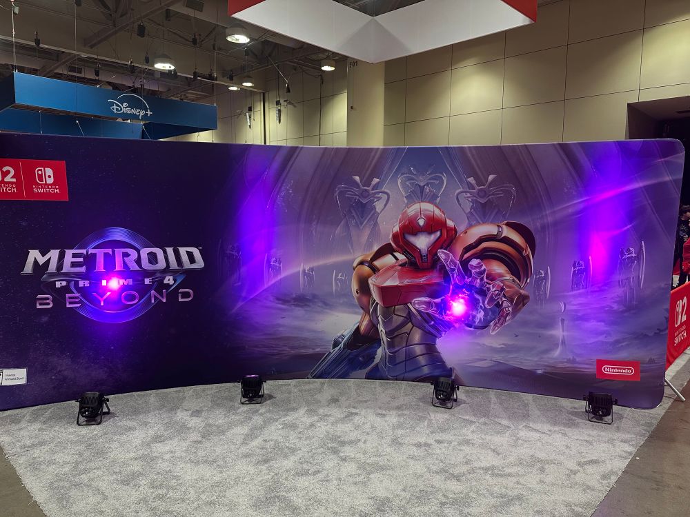 A mural for Metroid Prime 4 Beyond showing Samus Aran with their hand outstretched with a purple light emanating from their palm