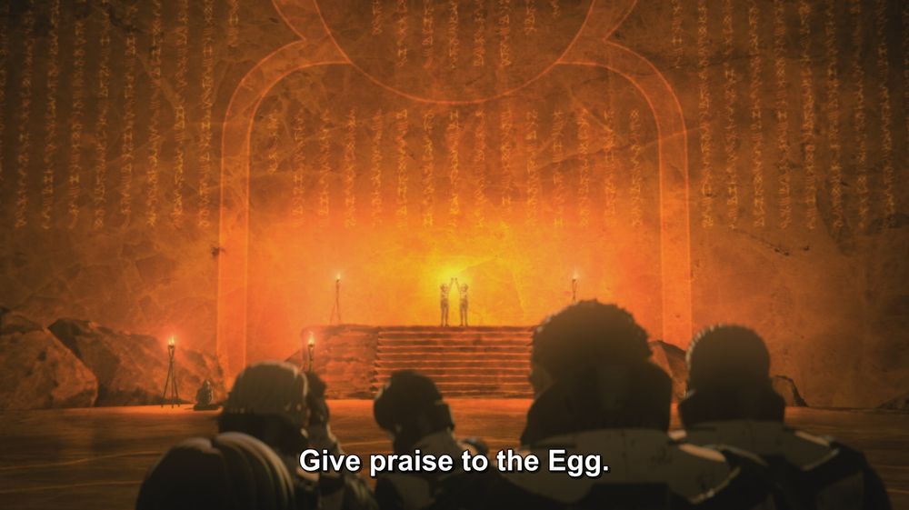 A frame from Godzilla: City on the Edge of Battle (2018).
In the foreground, several people in futuristic environment suits are standing, facing away from the camera. Some are holding their hands over their ears. In the distance, two women are holding their hands up to an enormous stone wall with some kind of script on it. The part of the wall they are touching is glowing with yellow light. 
The caption reads, "Give praise to the Egg."

Not pictured: Godzilla; The Egg