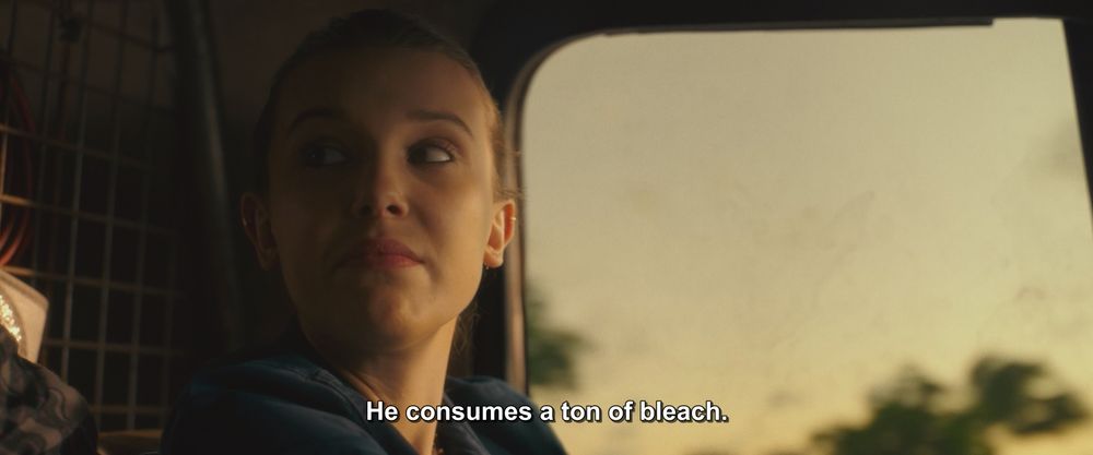 A frame from Godzilla vs Kong (2021).
A young girl sits in the driver's seat of a van. She's looking behind her at someone.
The caption reads, "He consumes a ton of bleach."

Not pictured: Godzilla; Kong; any good reason to consume bleach
DO NOT CONSUME BLEACH! DON'T INJECT IT EITHER!