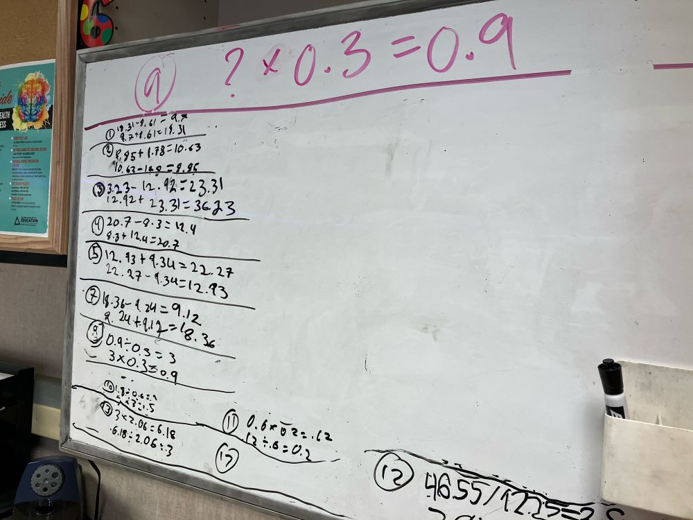 Whiteboard with a series of problems