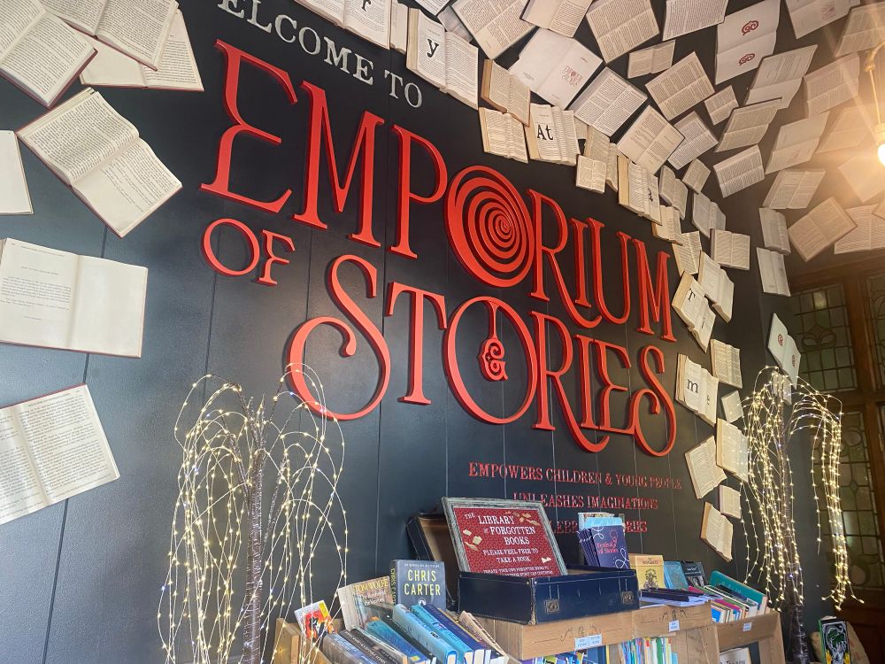 The entrance to Grimm & Co’s ‘Emporium of Stories’. Magical with open books decorating the ceiling.